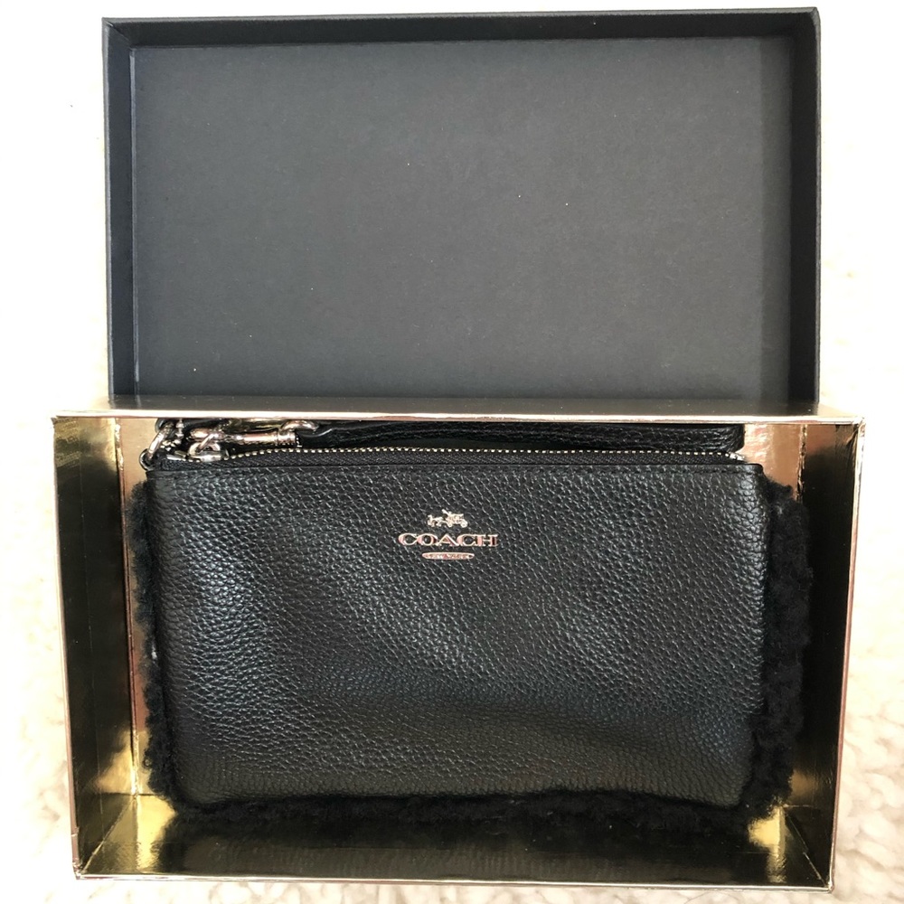 Black pebble leather Coach wristlet with gift box.
